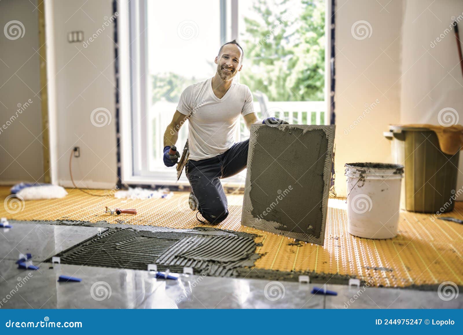 Nice Handyman Install Tile on the Floor Stock Image Image of laborer
