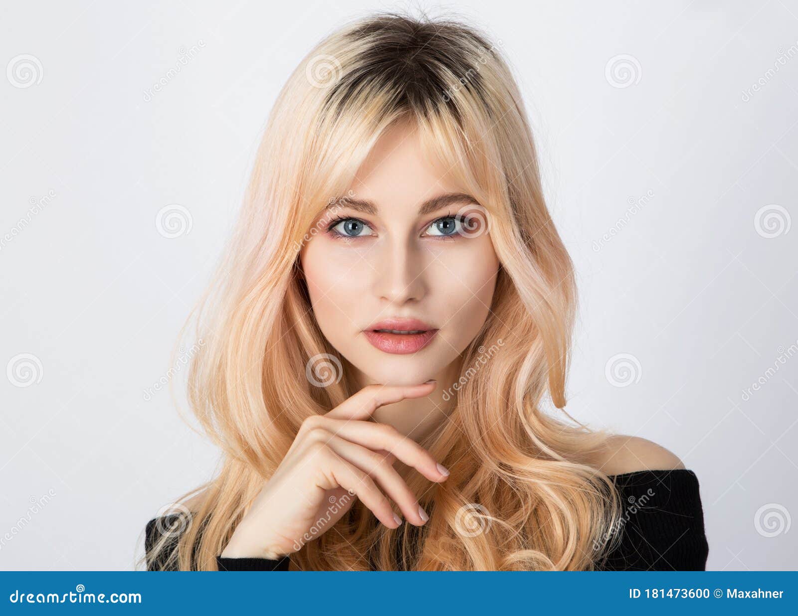 Nice Look of a Blonde Girl with Overgrown Dark Roots and Soft and Light ...