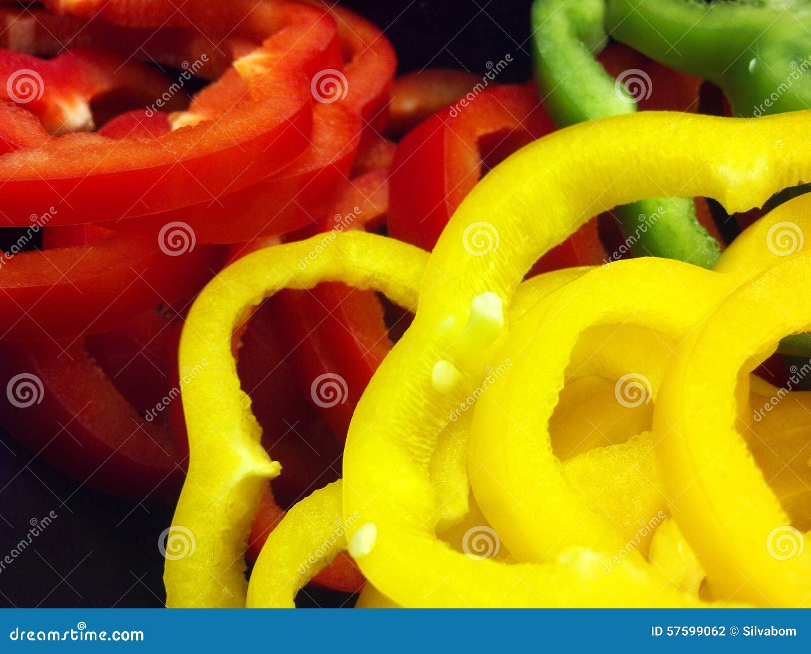 Nice Macro of Sliced Sweet Peppers on Black Background Stock Photo