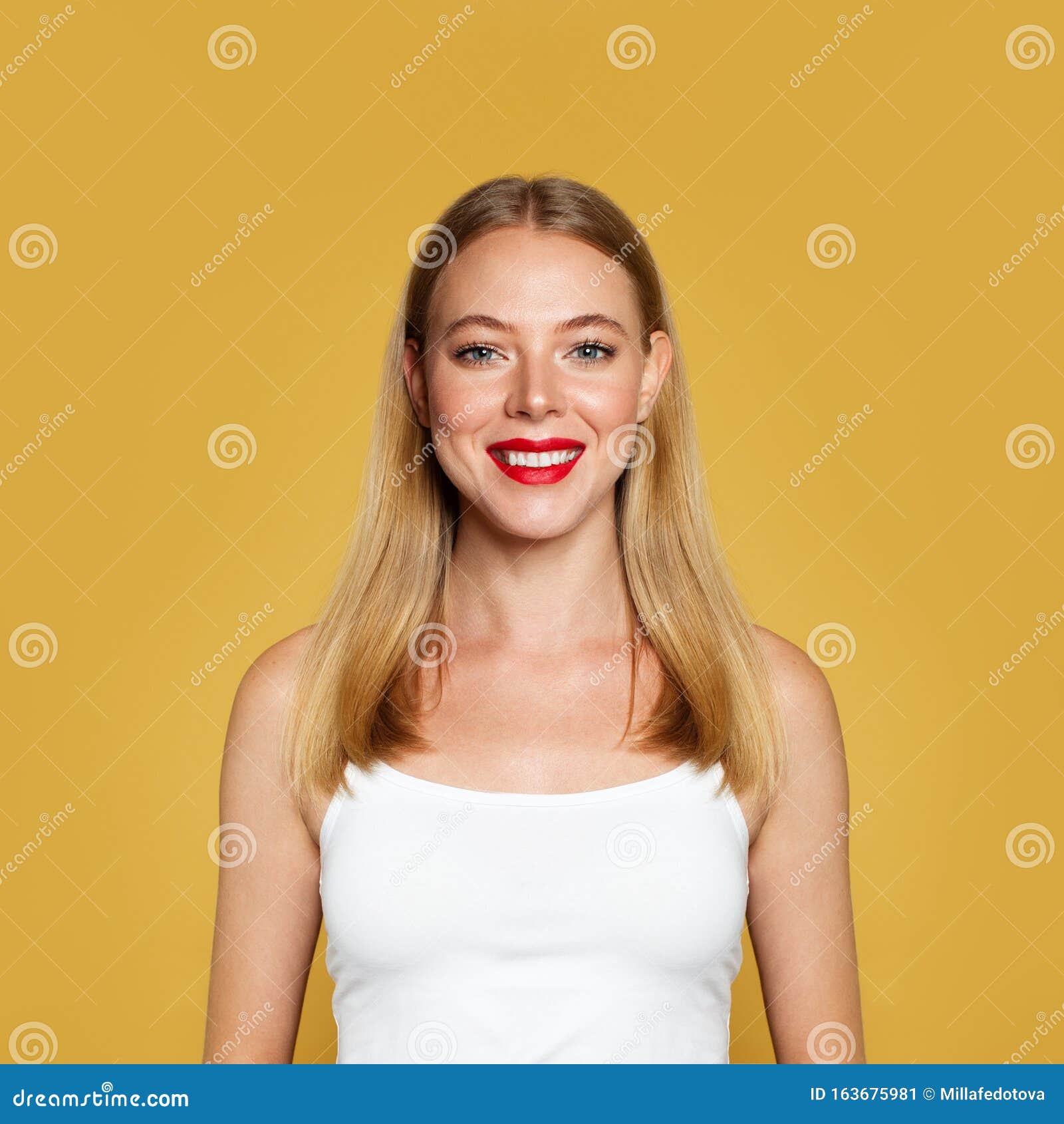 nice positive woman on yellow background. portrait, positive emotion