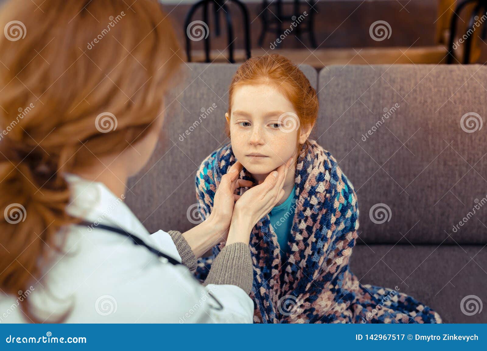 Nice Red Haired Girl Having Her Throat Checked Stock Image I
