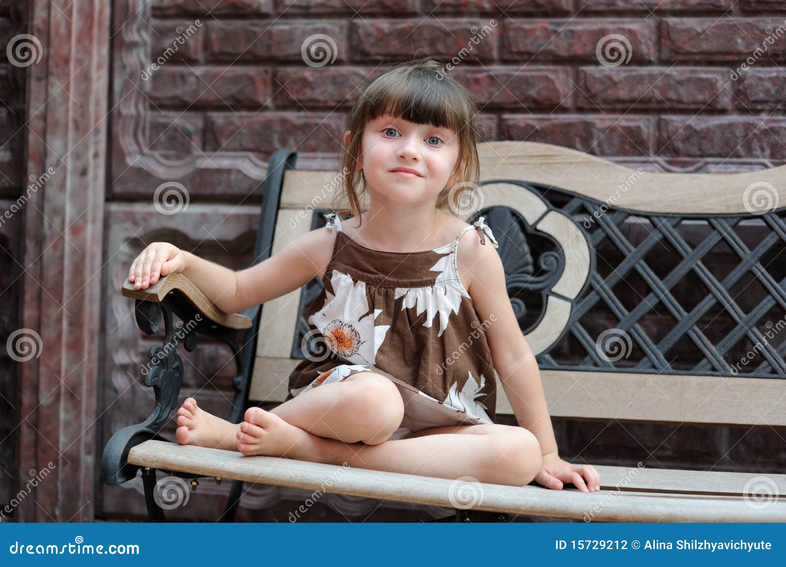 nice toddler girl on bench