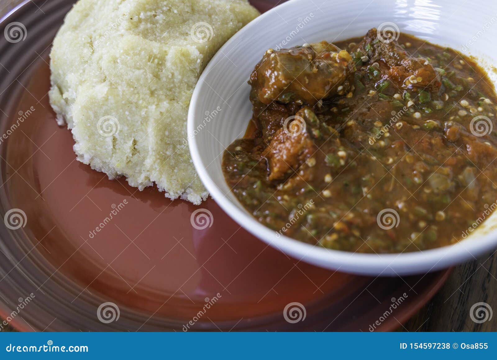 nigerian spicy okro and pepper stew served with eba ready to eat