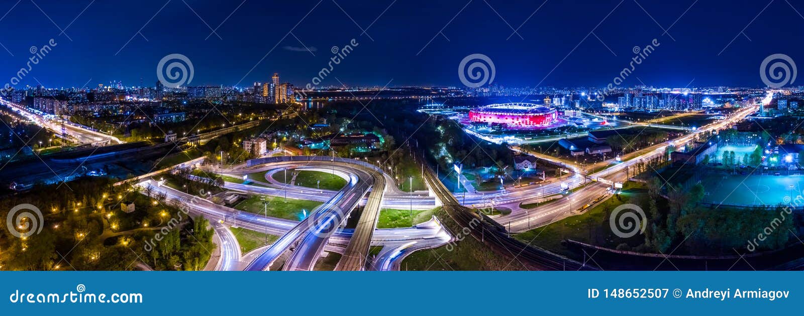 night aerial view panorama of a freeway intersection traffic trails in night moscow