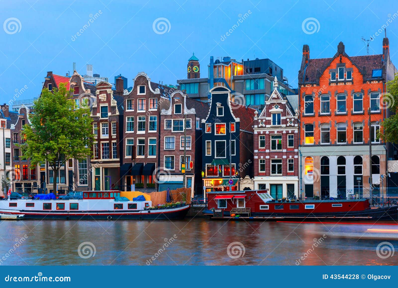 night city view of amsterdam canal with dutch houses