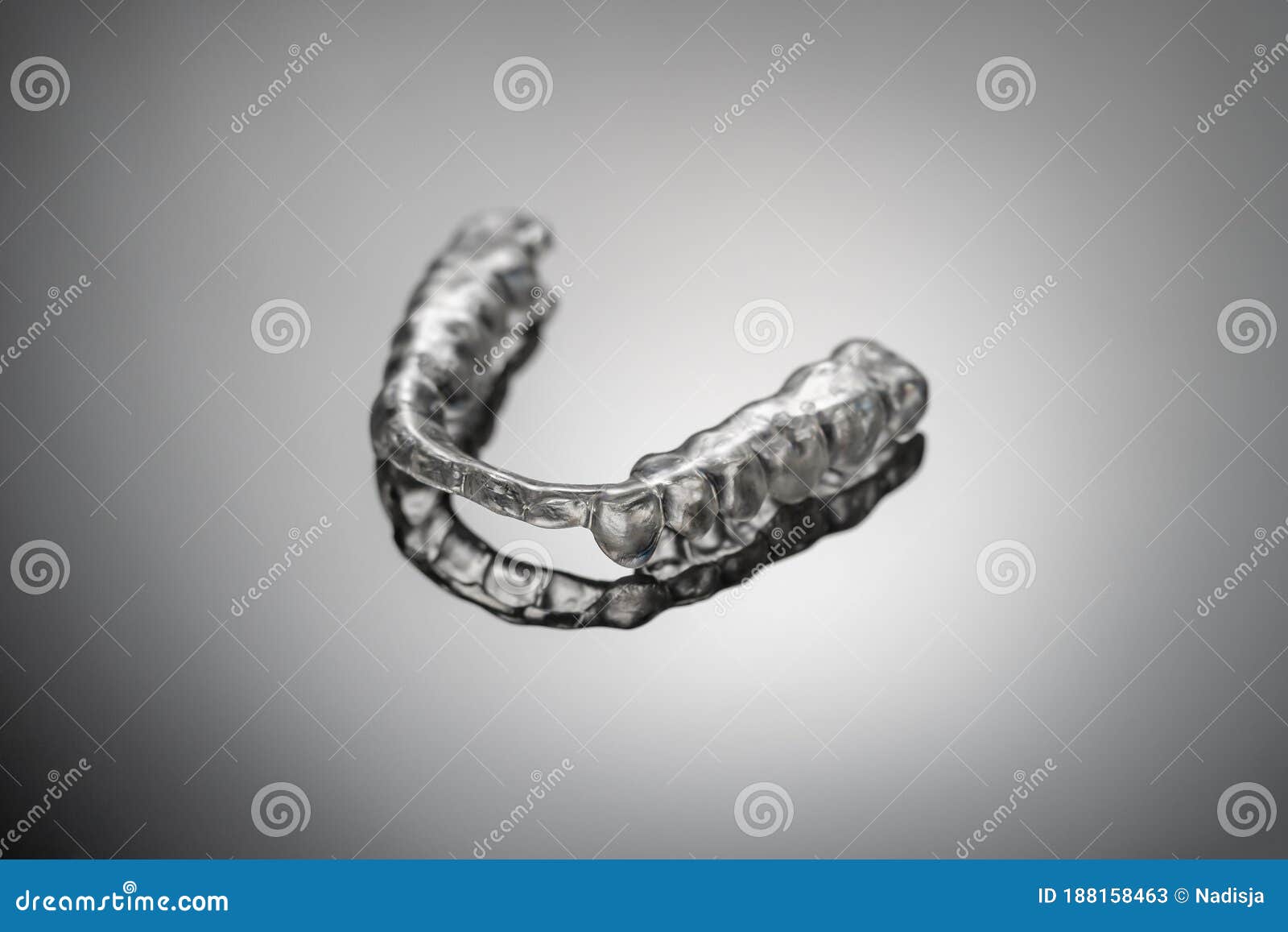 night dental guard by bruxism on gray background