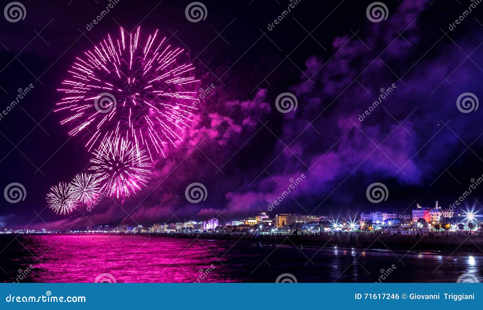 night fireworks explosion on seafront. rimini notte rosa