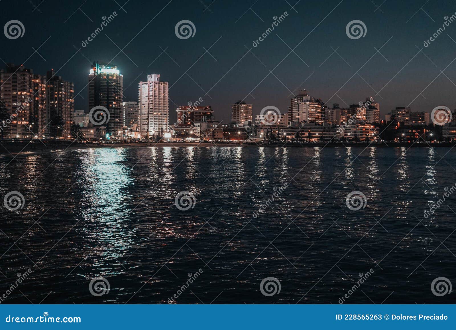 night image of some buildings in a coastal city