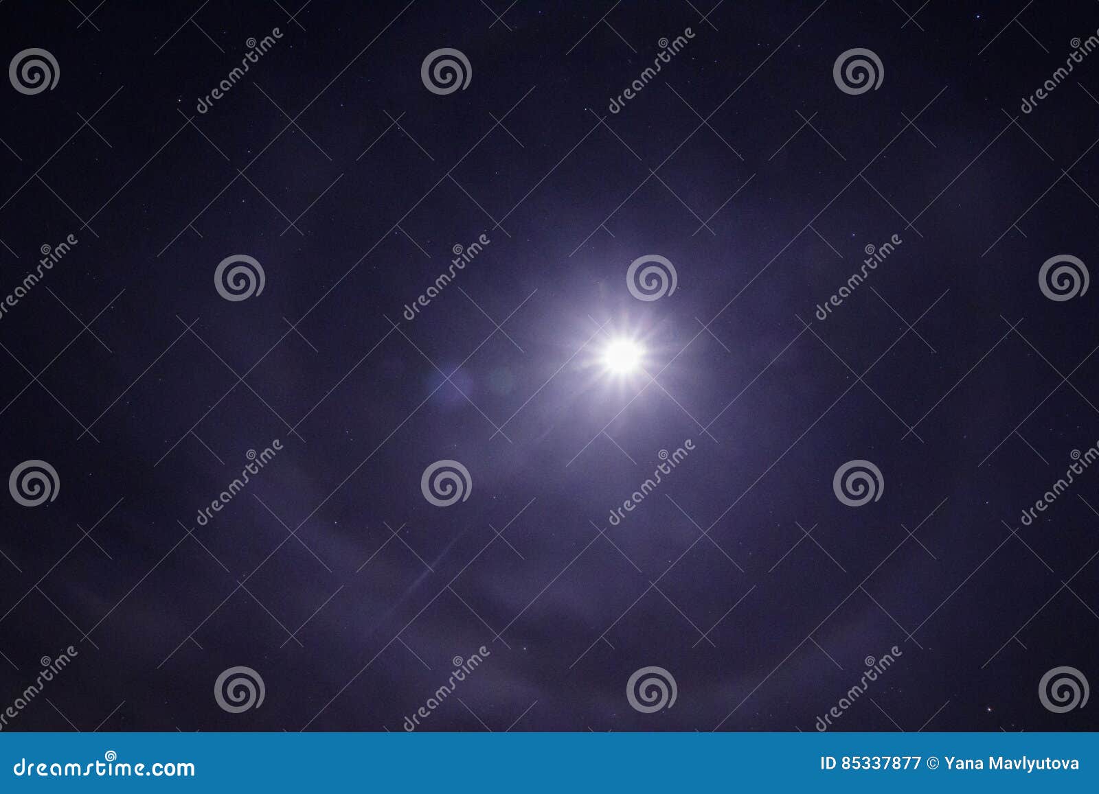 Night Landscape in Long Exposure with Moon Halo Vision with Stars Stock