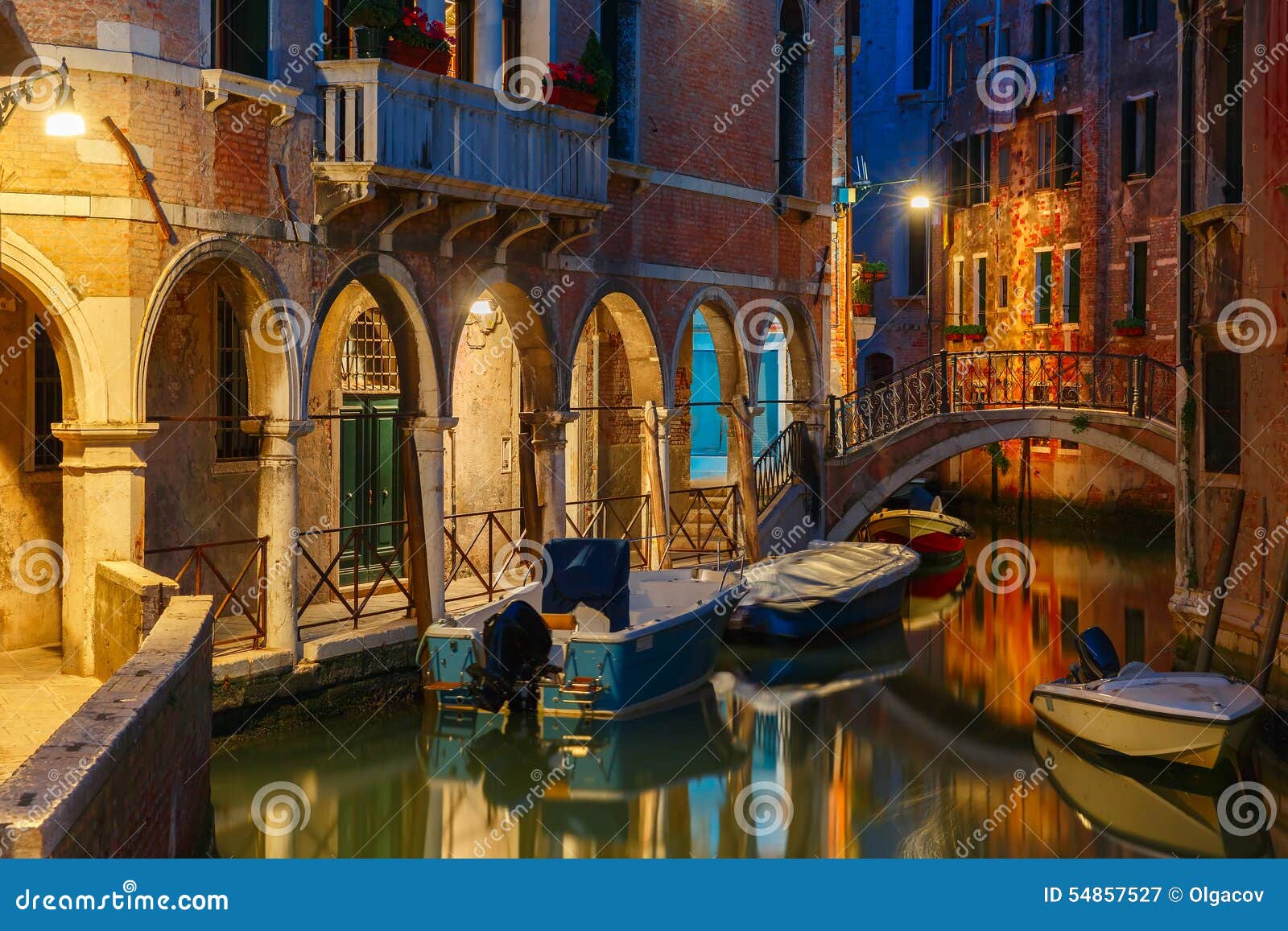 night lateral canal and bridge in venice, italy