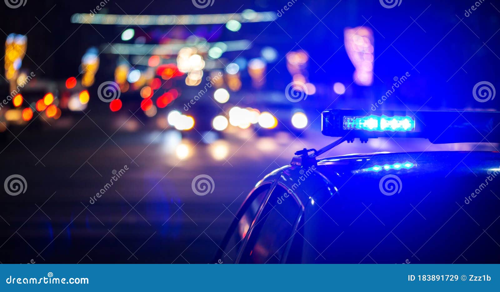 night police car lights in city - close-up with selective focus and bokeh