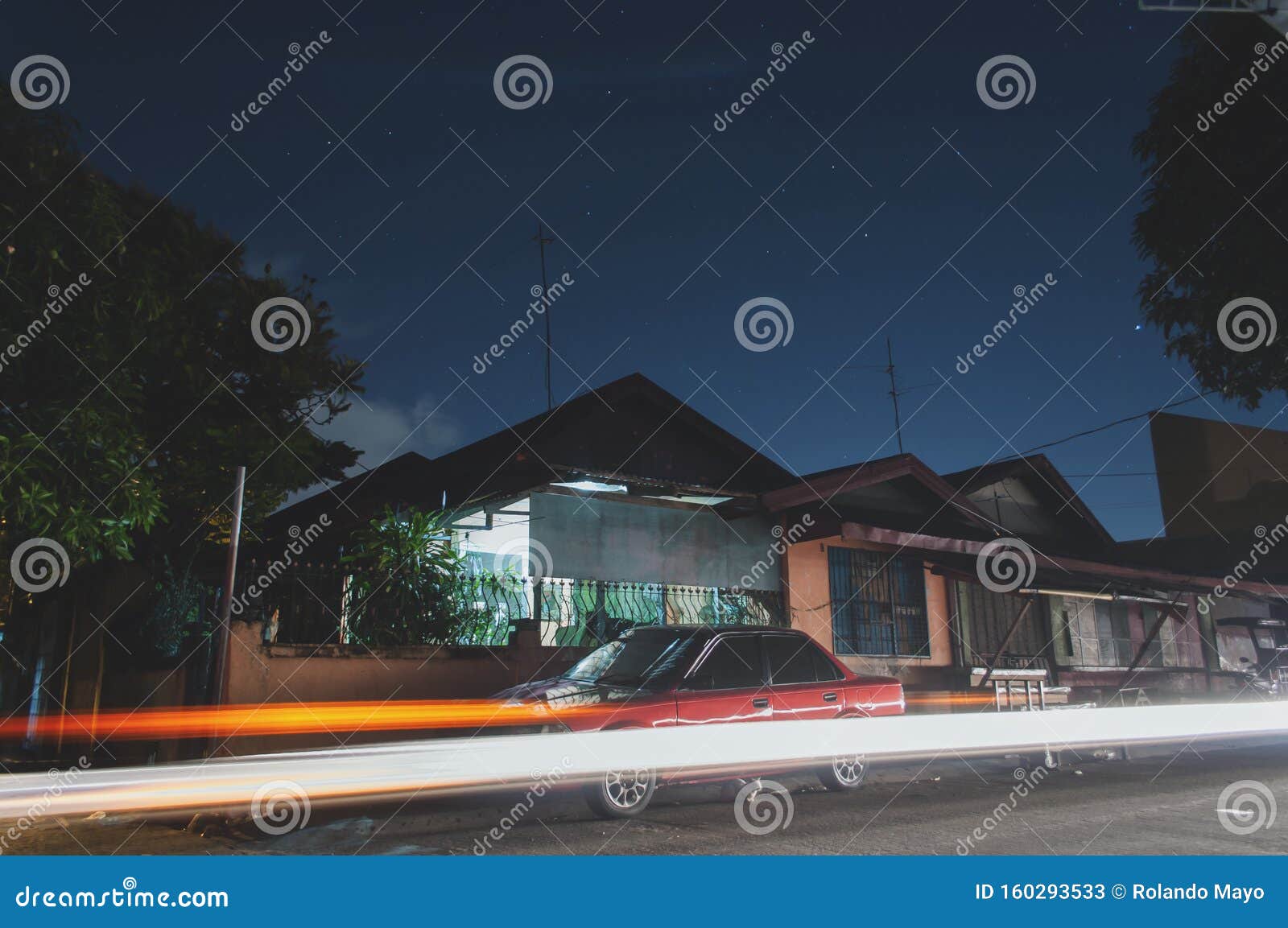 Long Exposure Shot Of Simple Bungalow Concrete House In A Subdivision In An Urban Area In The Philippines With A Cat Under The Car Stock Image Image Of Dark Simple 160293533