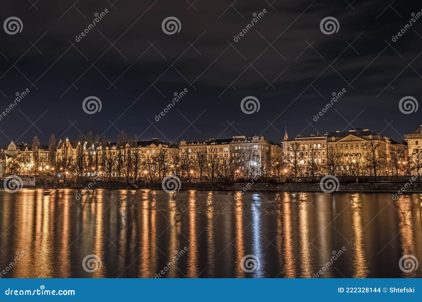 a night shot of prague from slavonic island over vltava and towards smichov and jirÃÂ¡sek bridge - jiraskuv most