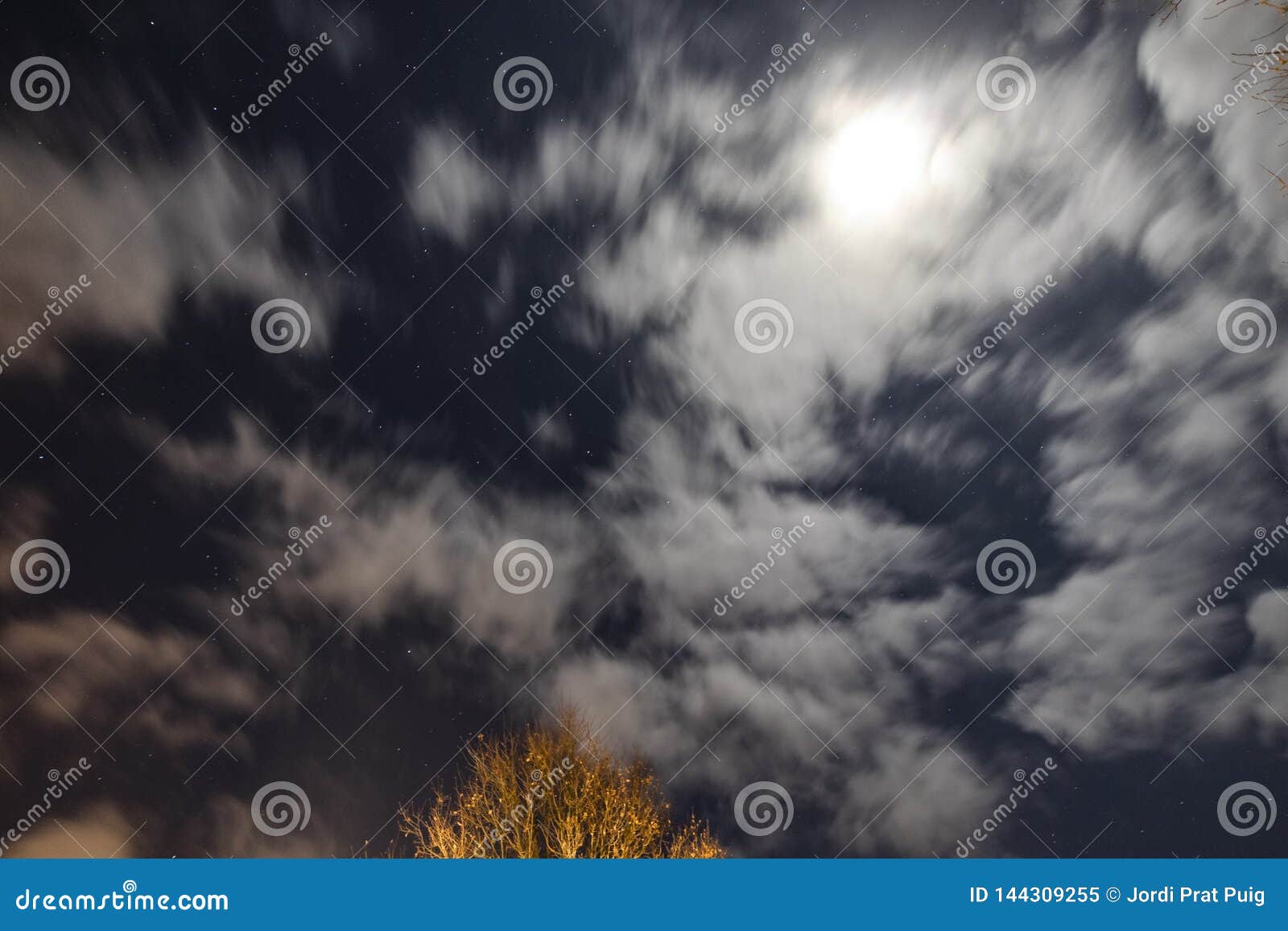 Night Sky Scene with Moving Clouds Lighted by the Moonlight Stock Image