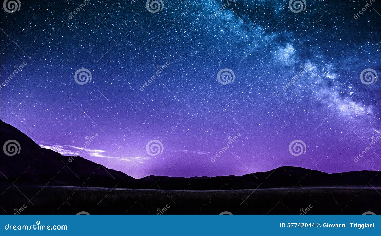 night sky stars with milky way over mountains. italy