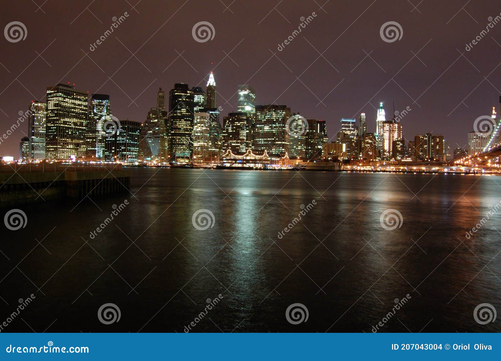 night view of the most emblematic buildings and skyscrapers of manhattan (new york). brooklyn bridge. river hudson.