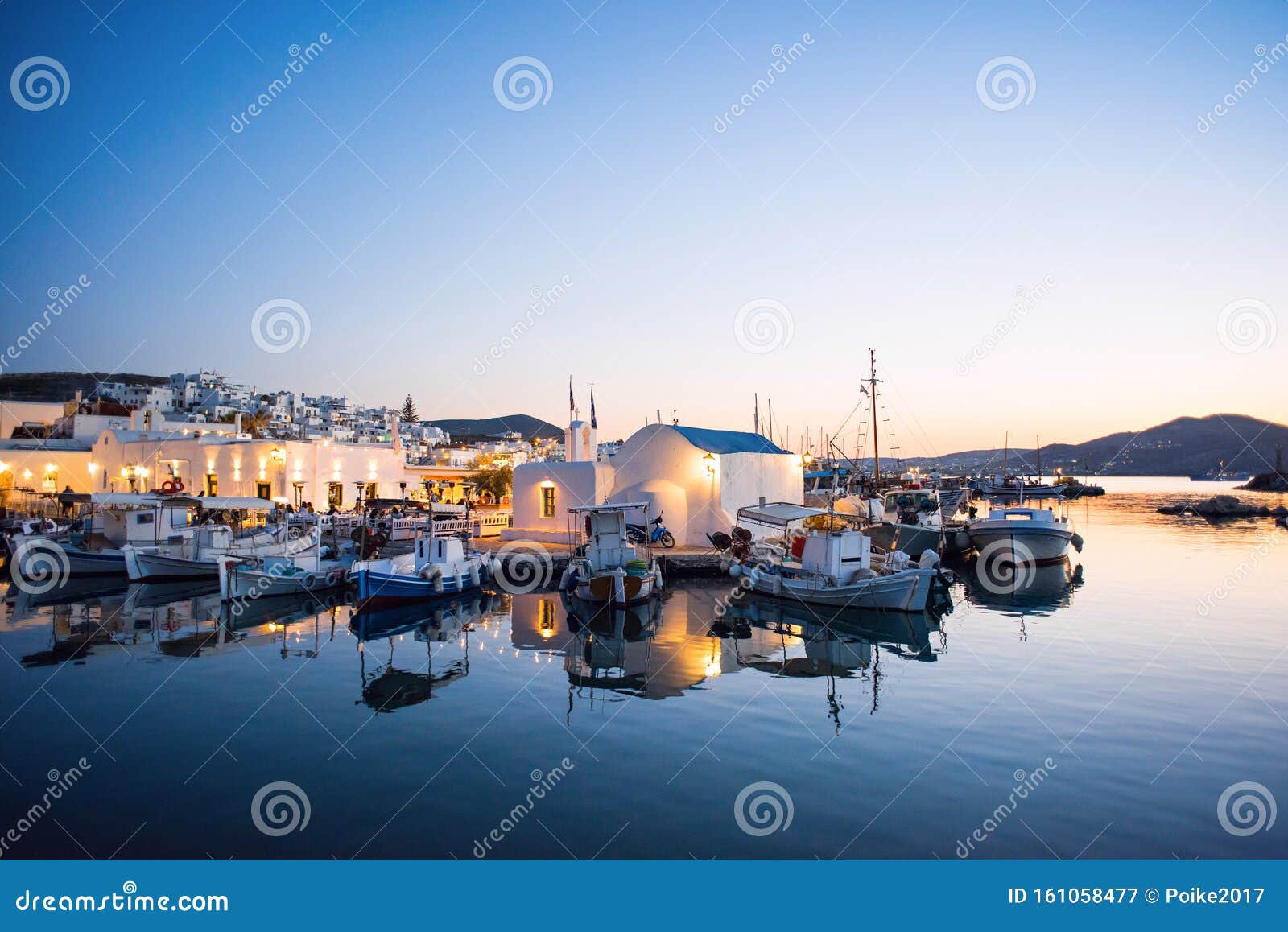 night view of naoussa village, paros island, greece. popular tourist destination in europe.