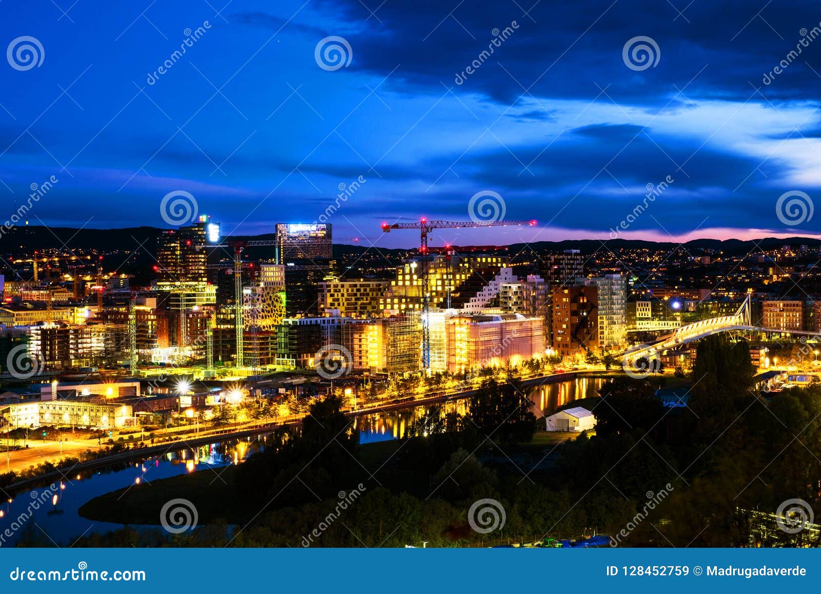 a night view of sentrum area of oslo, norway, with barcode buildings