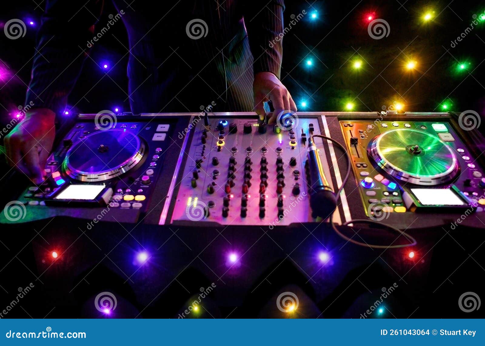 nightclub dj mixing decks at a house party, disco, rave or wedding