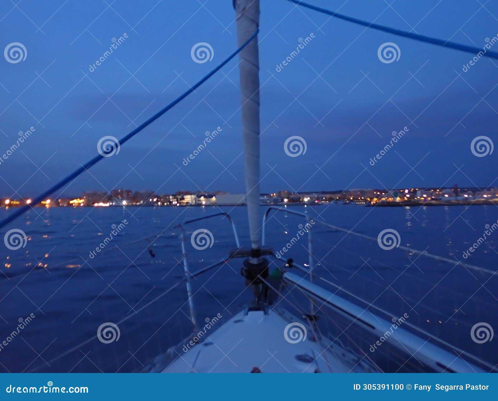 at nightfall, the sailboat arrives at the port