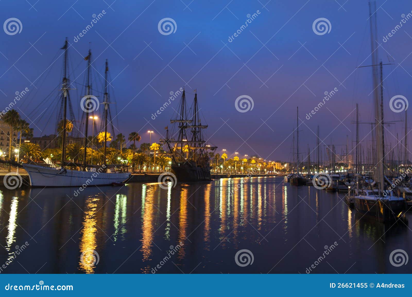 nightscene with tall ships in harbour