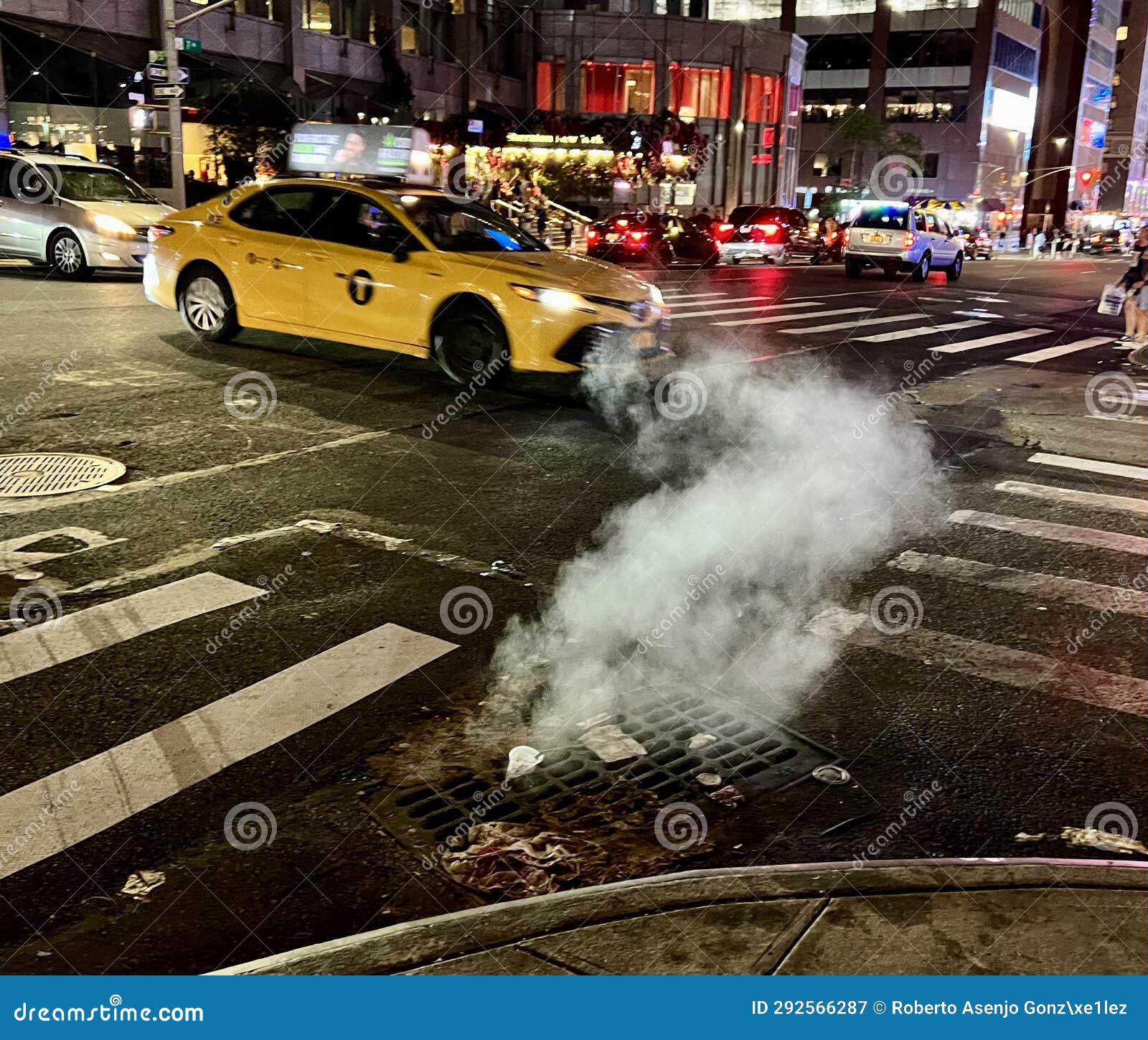 nighttime image of a cab on the streets of new york city