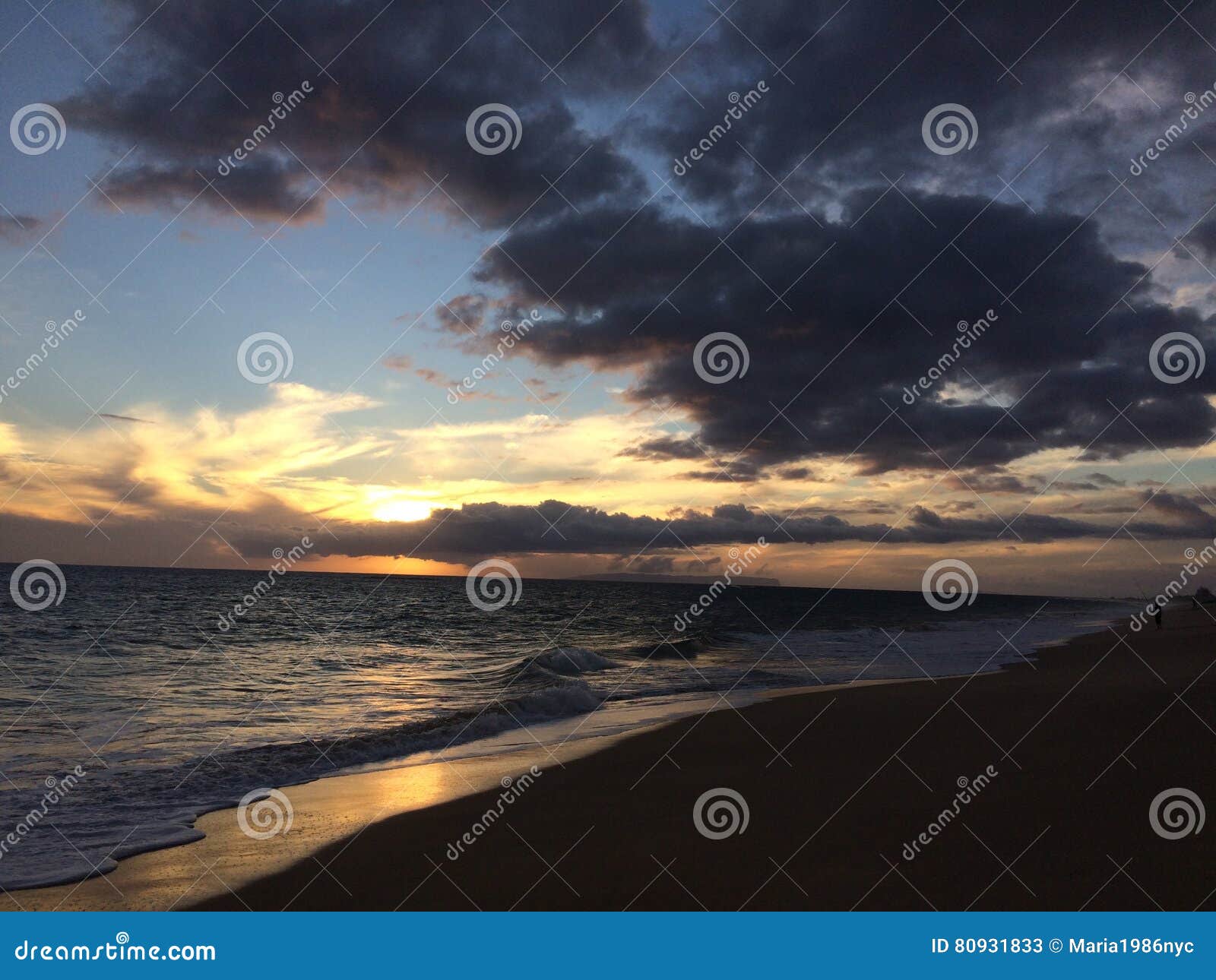 niihau island seen on ocean horizon during sunset - view from kekaha on kauai island, hi.