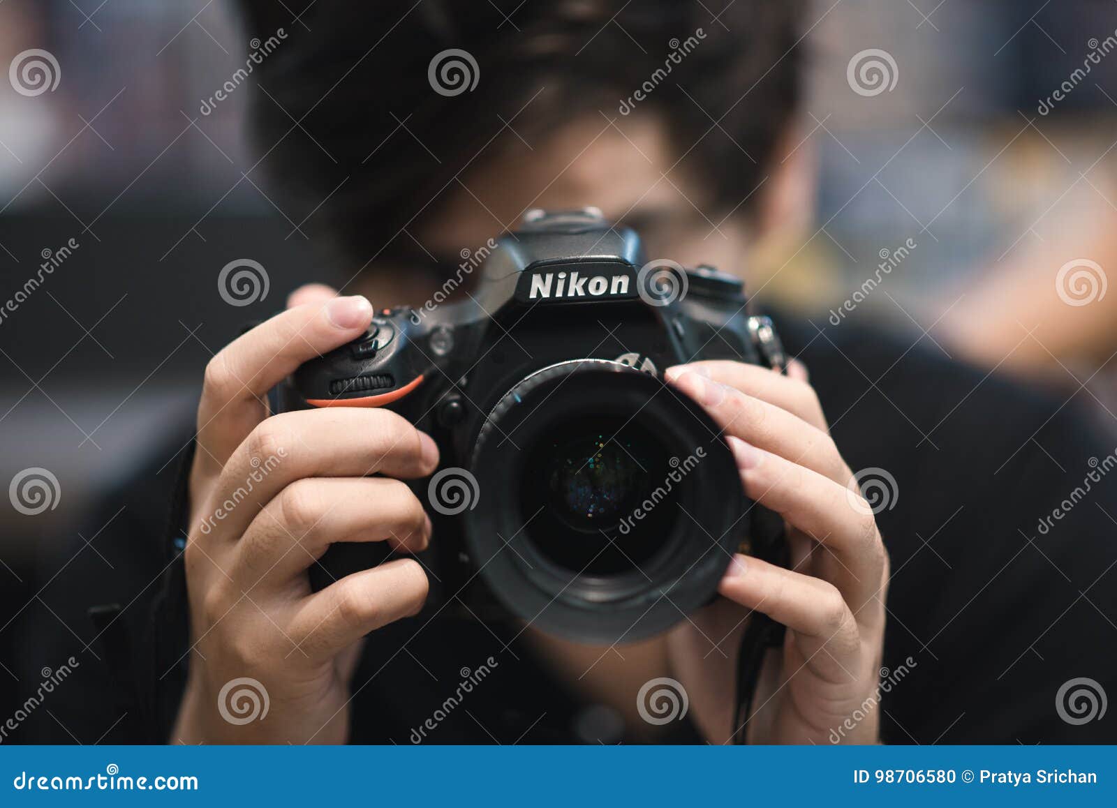 Nikon DSLR Photographer editorial image. Image of lens 98706580