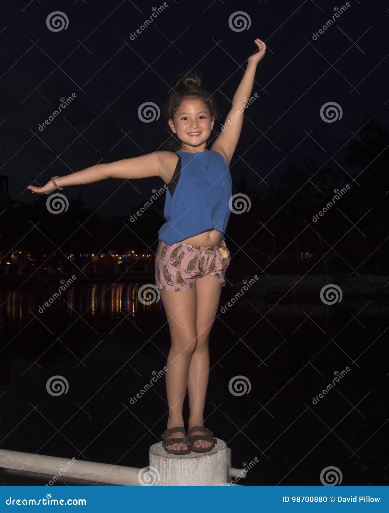 Nine Year Old Girl Singing With Microphone Royalty Free Stock Photo