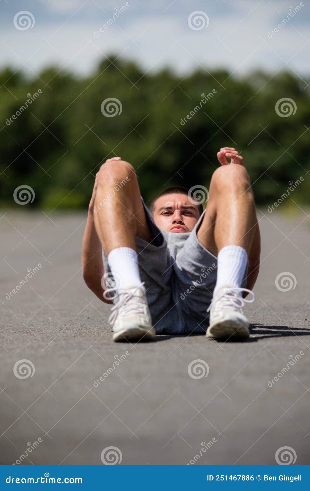 A 19 Year Old Teenage Boy Doing Situps in a Public Park Stock Photo ...