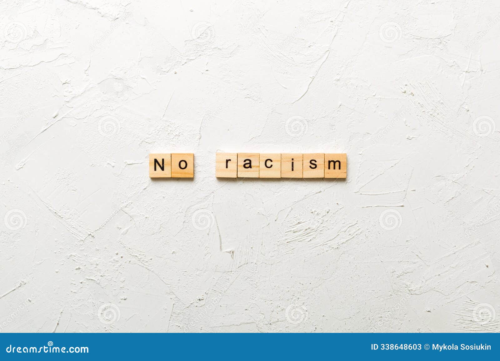 no racism word written on wood block. no racism text on table, concept