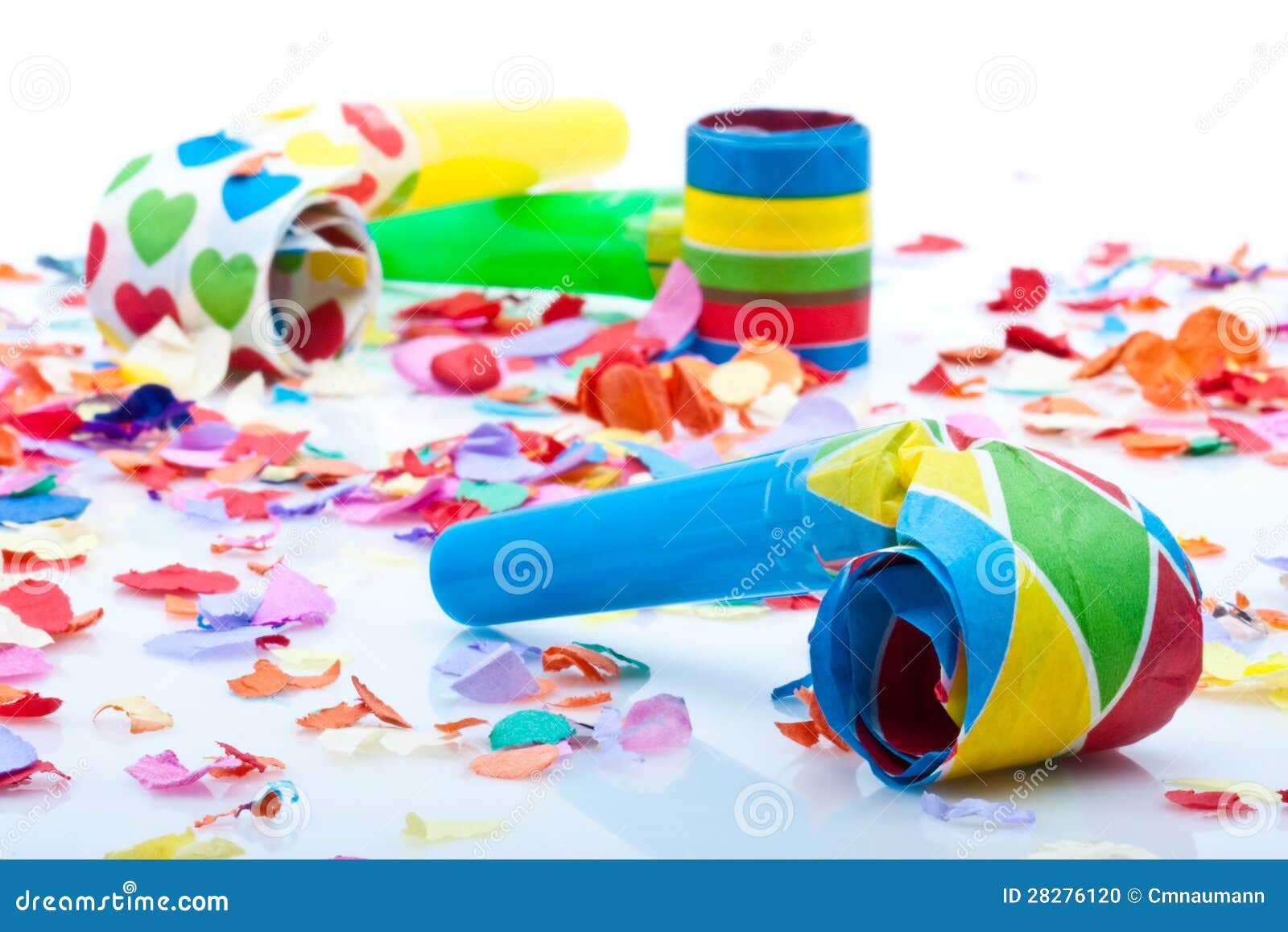Noisemakers for a Party on White Background with Confetti Stock Photo