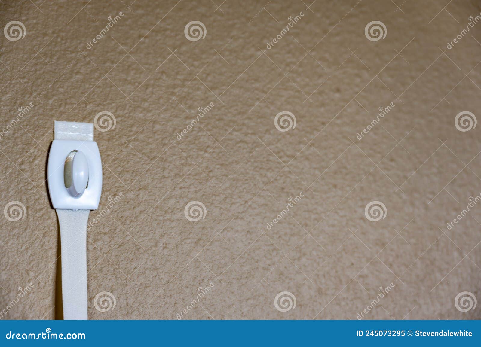 Selective Focus on Adhesive Strip Wall Hanger that Can Be Removed by