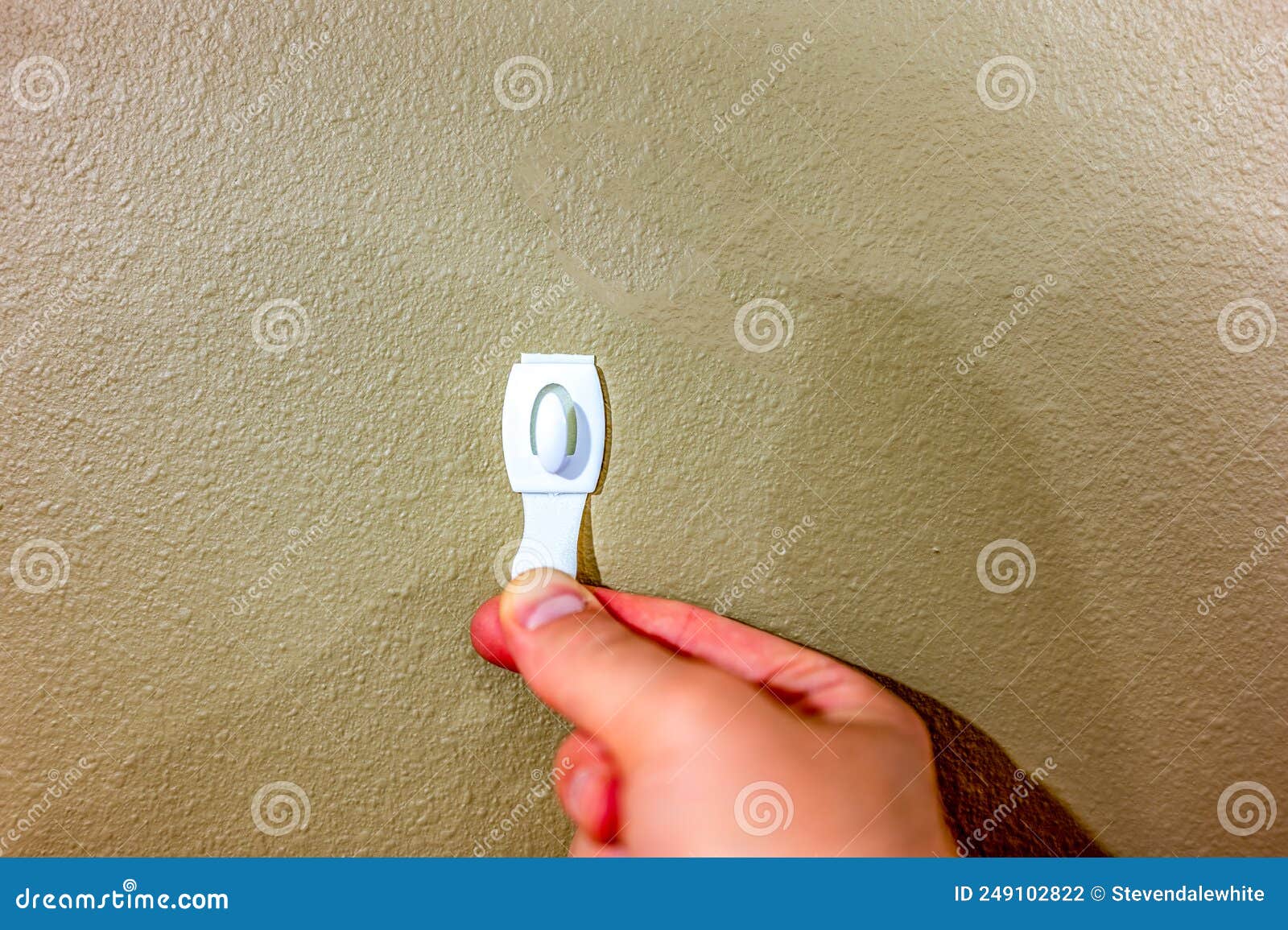 Selective Focus on Adhesive Strip Wall Hanger that Can Be Removed by