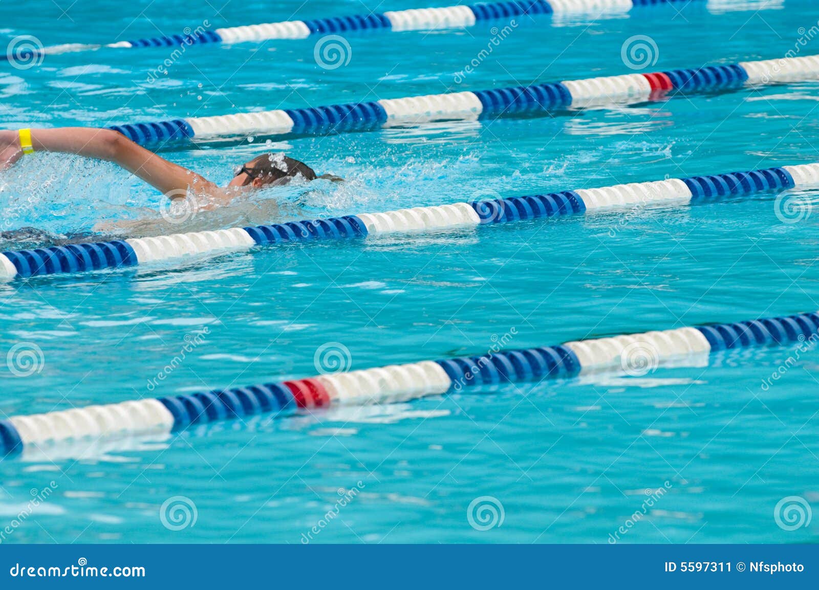 non-identifiable swimmer in outdoor swimming pool