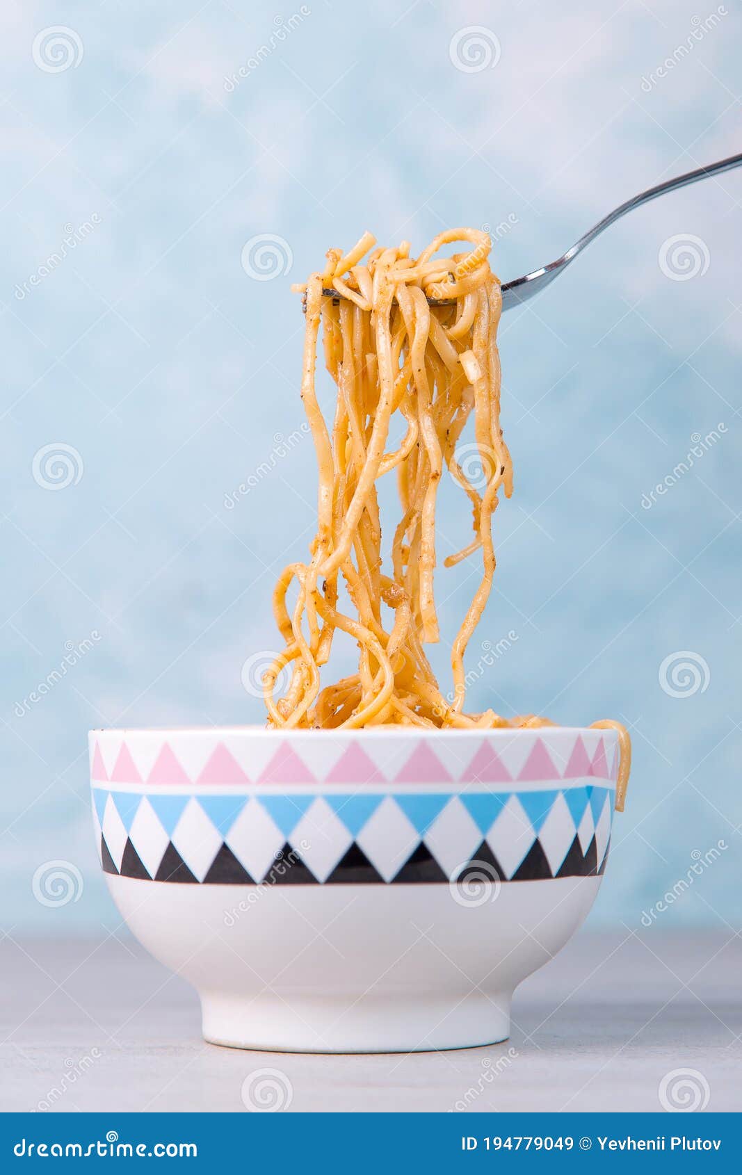 Noodles with Sauce in a Colored Bowl with Fork, Appetite Spaghetti on a