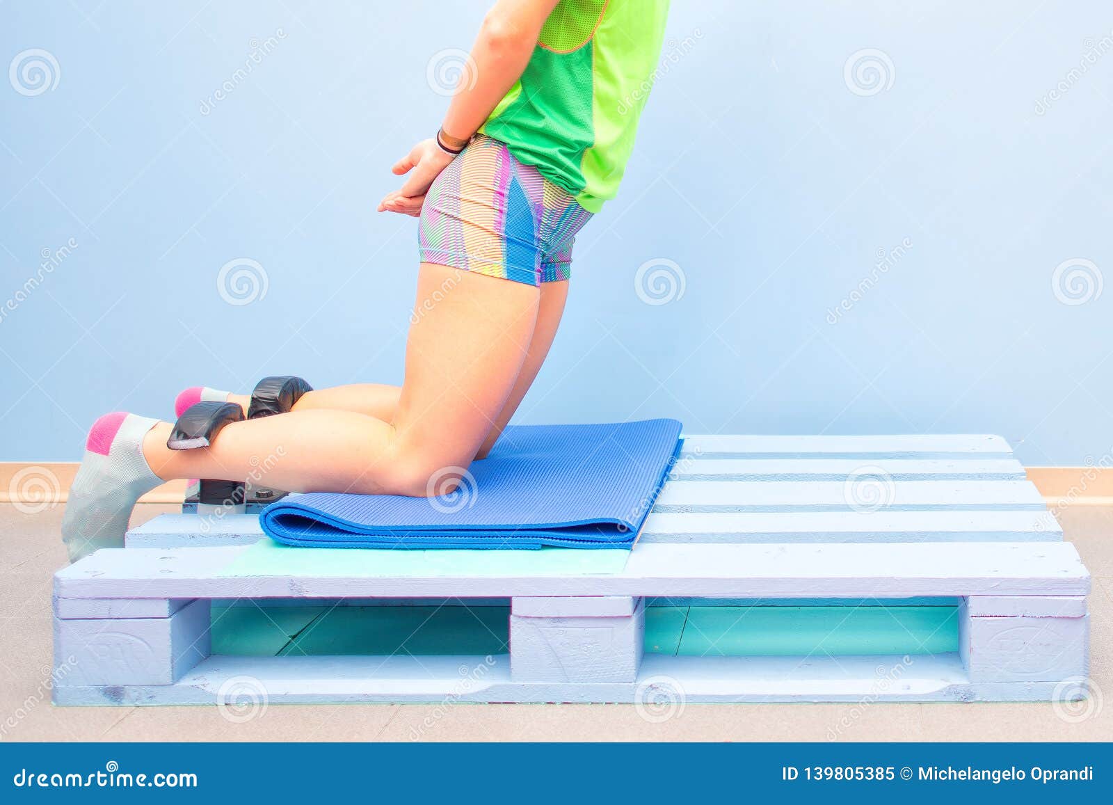 nordic hamstring exercise on a pallet at the gym