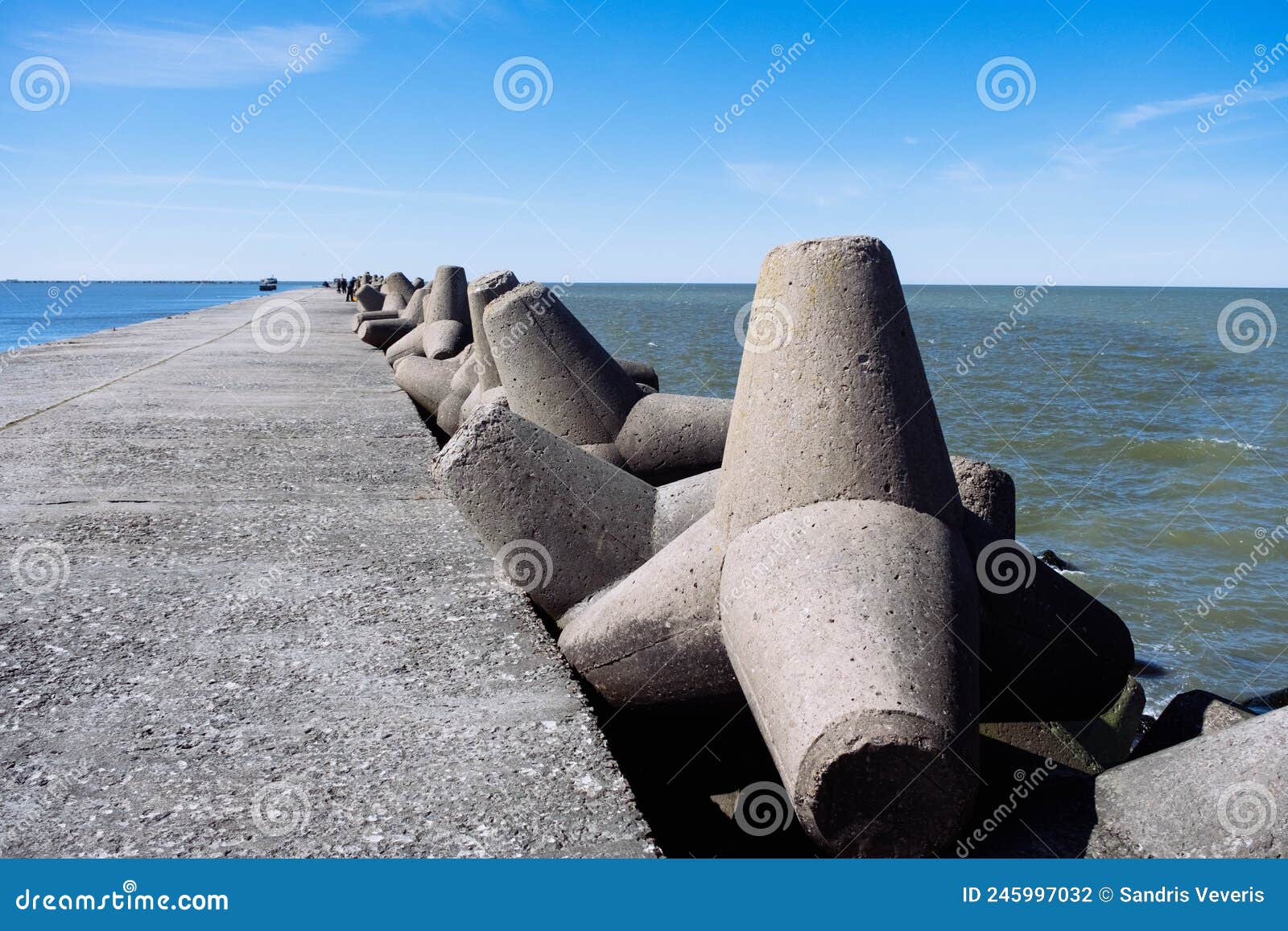 the northern breakwater in liepaja, a close-up of tetrapods and splashing, splattering waves. dolosse structure in the baltic sea