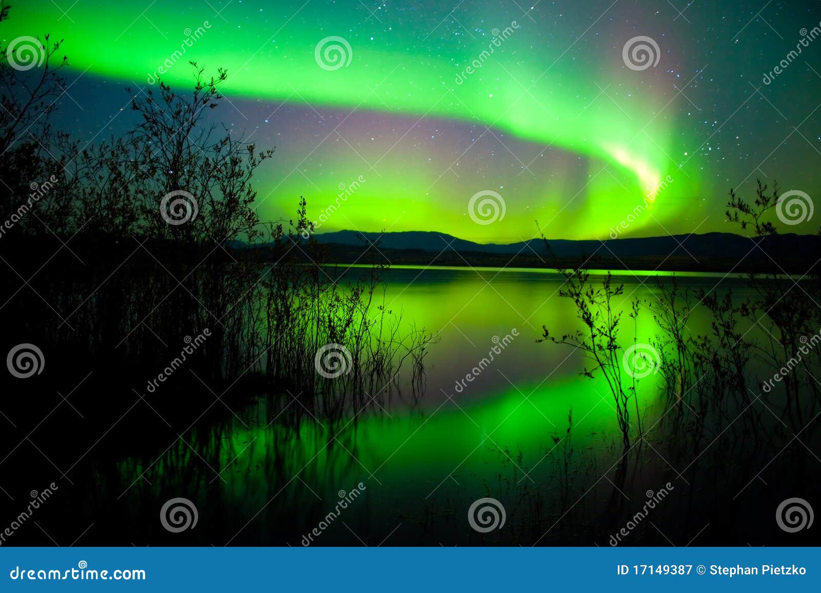 northern lights mirrored on lake