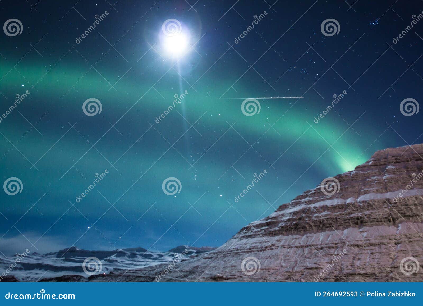 Northern Lights and Moon Over Mountain Landscape Photo Stock Image