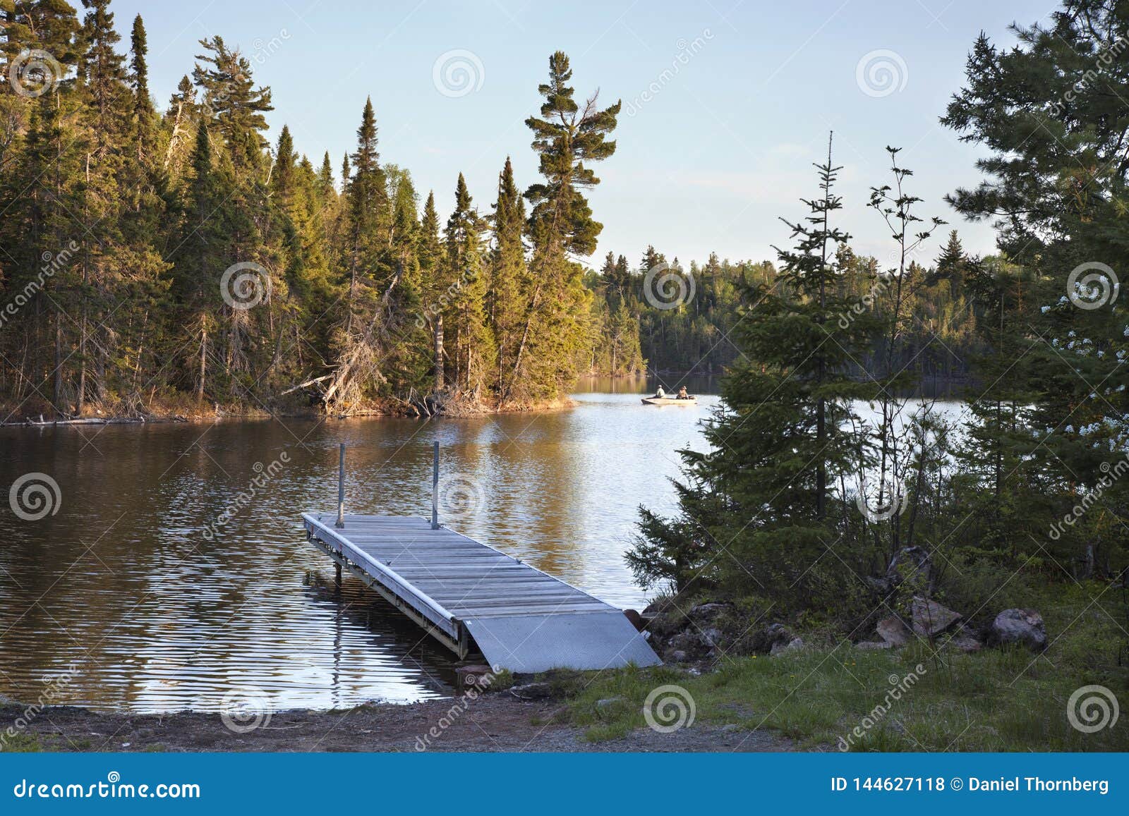 Northern Minnesota Lake with Dock and Fishermen in the Distance Stock ...