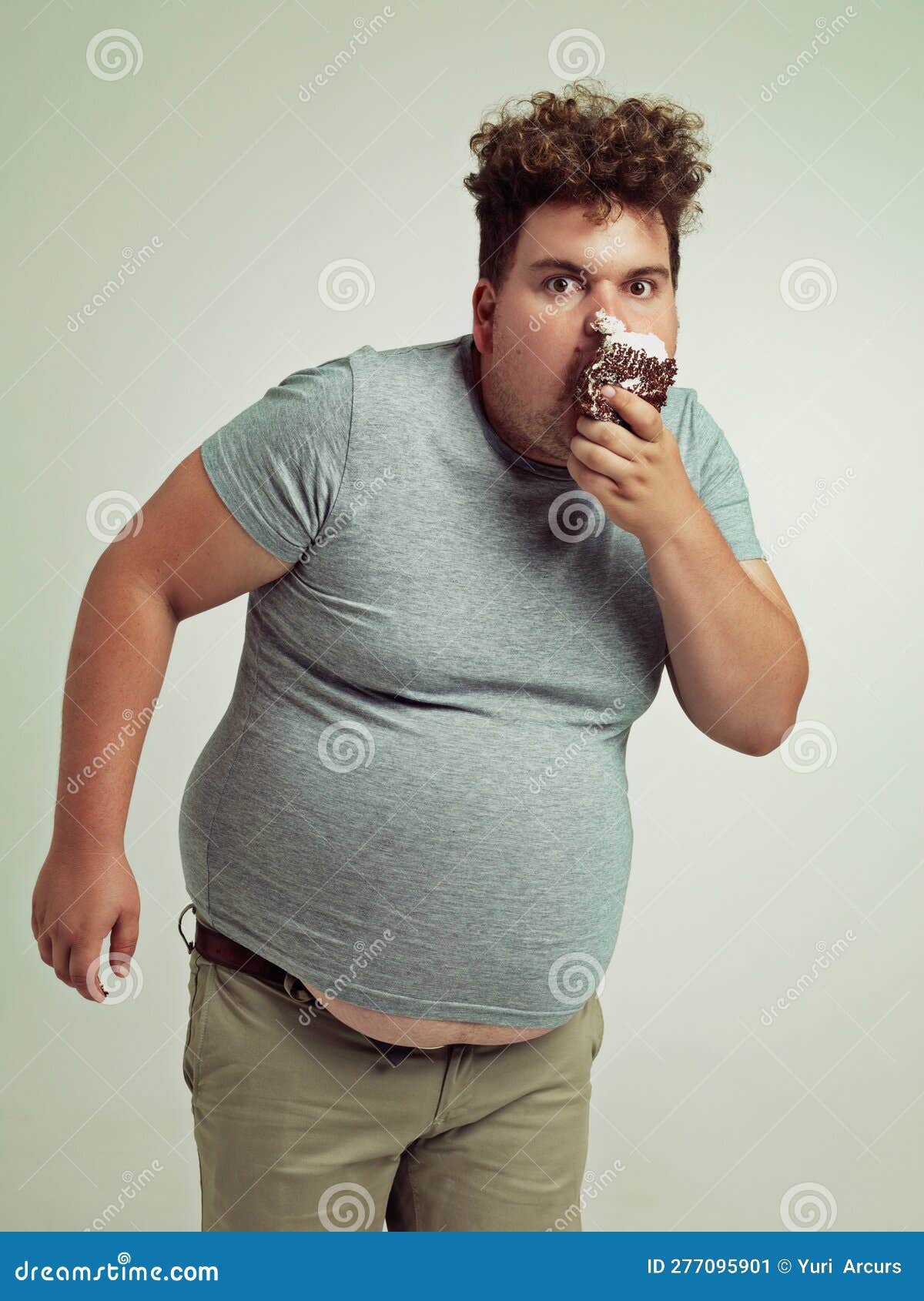 This is Not Cake...an Overweight Man Messily Eating a Slice of Cake