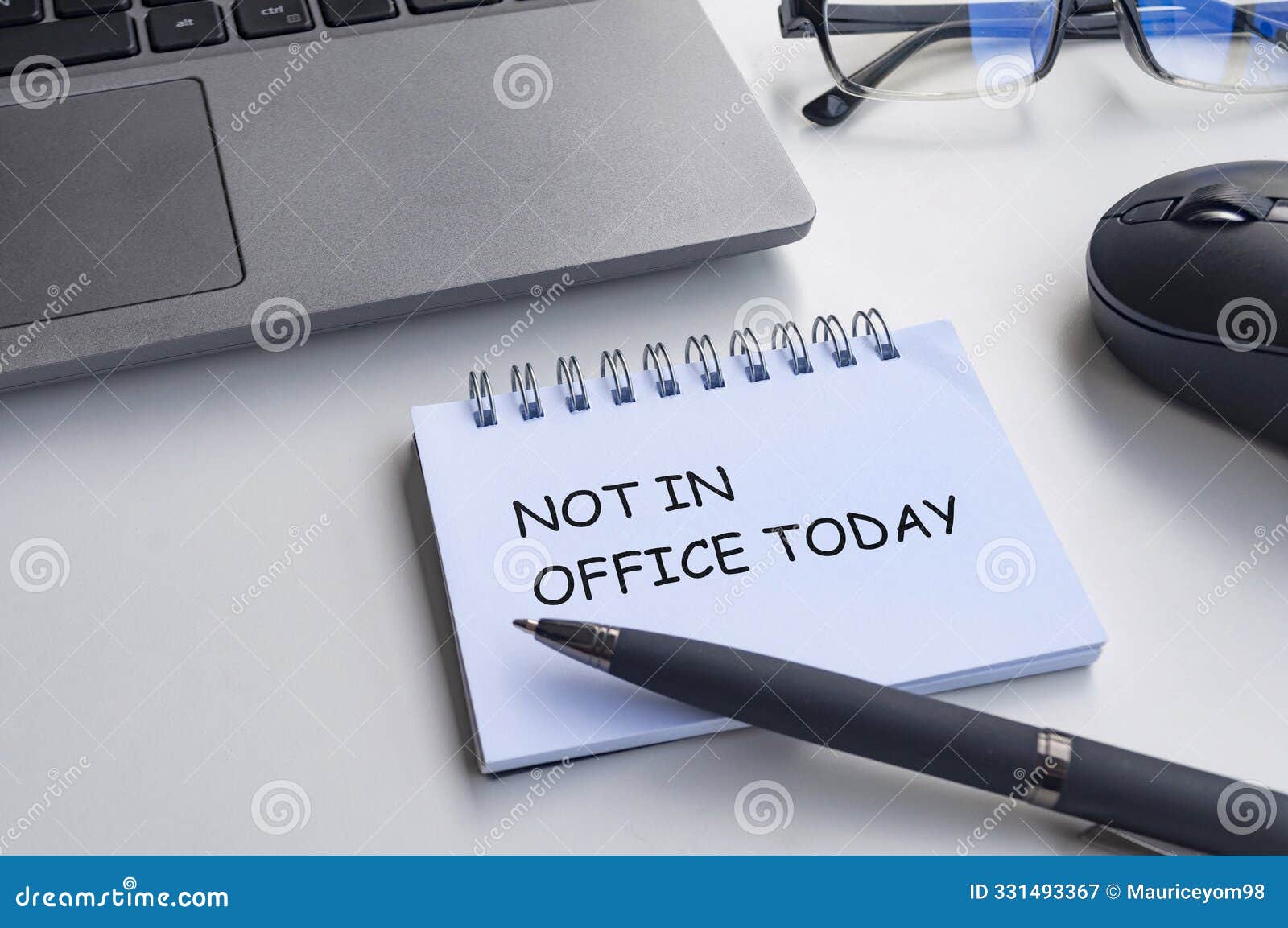 not in office today text on with notepad with office background. out of office concept