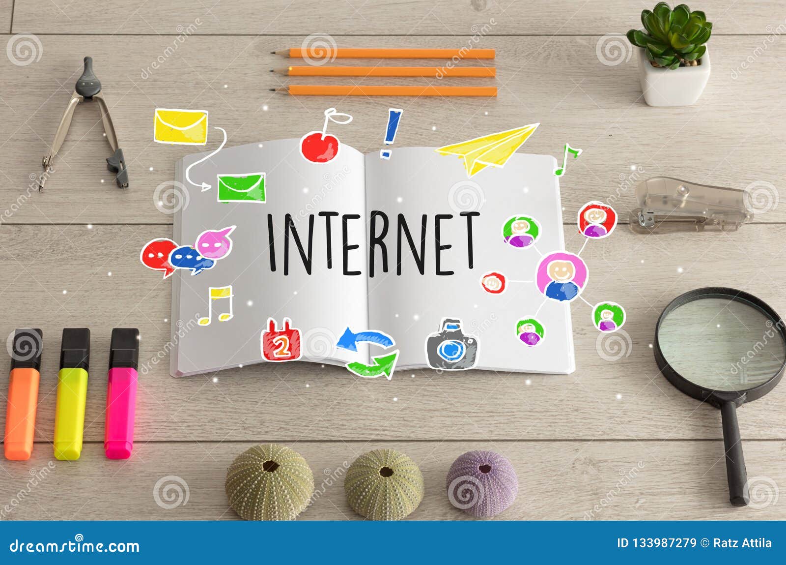 open booklet and office tools on the floor