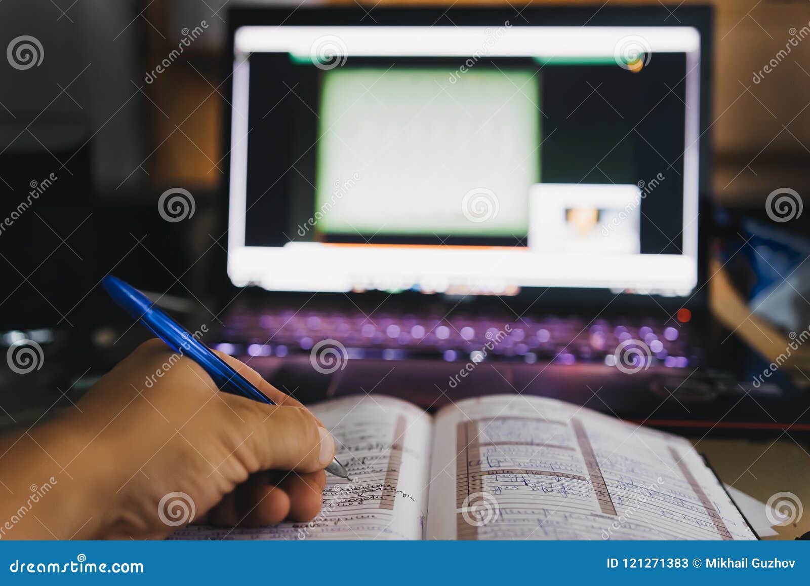 computer and notebook and the man in her records