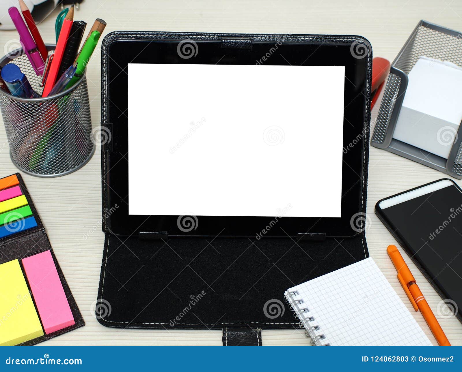 Notebooks, Tablets, Pens and Student Materials on the Course Table