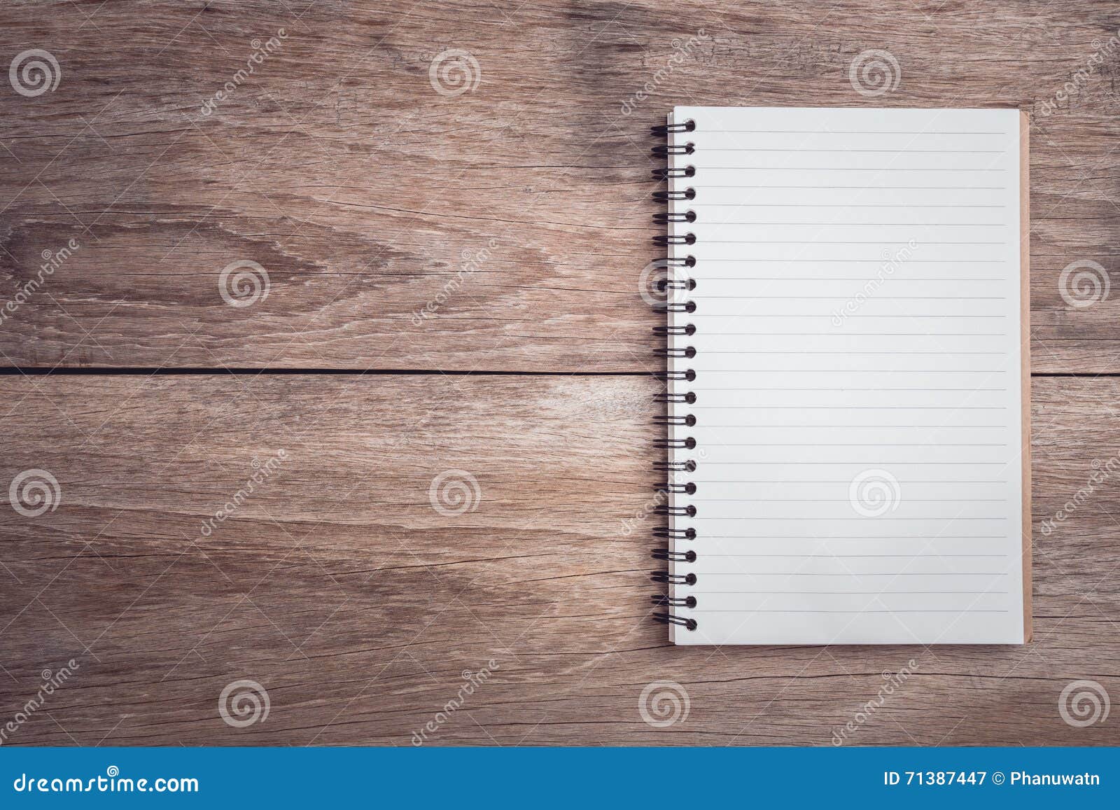 notepad / lined paper on wooden table top view