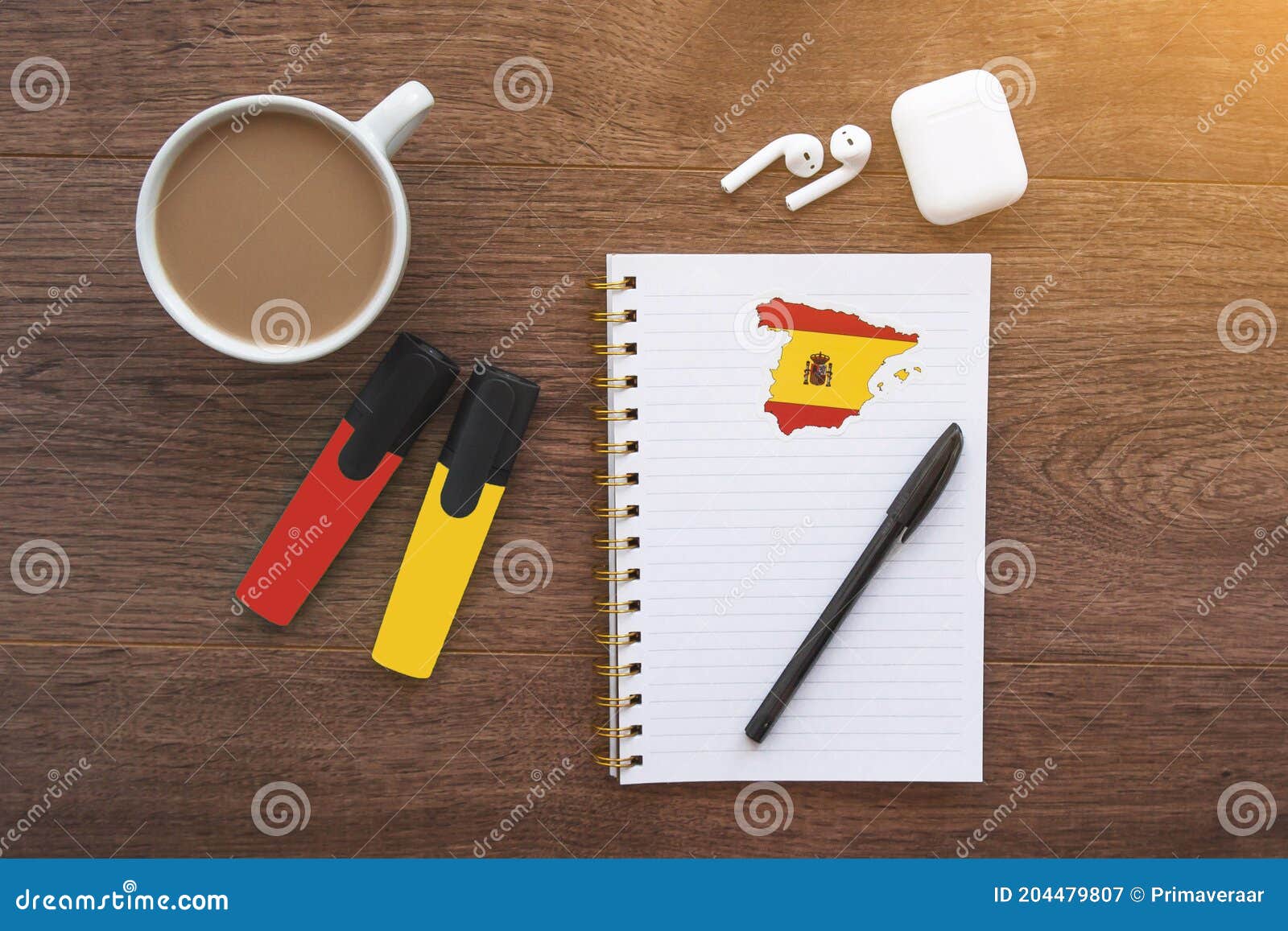 Notepad with Spanish Flag, Wireless Headphones, Coffee Cup, Pen