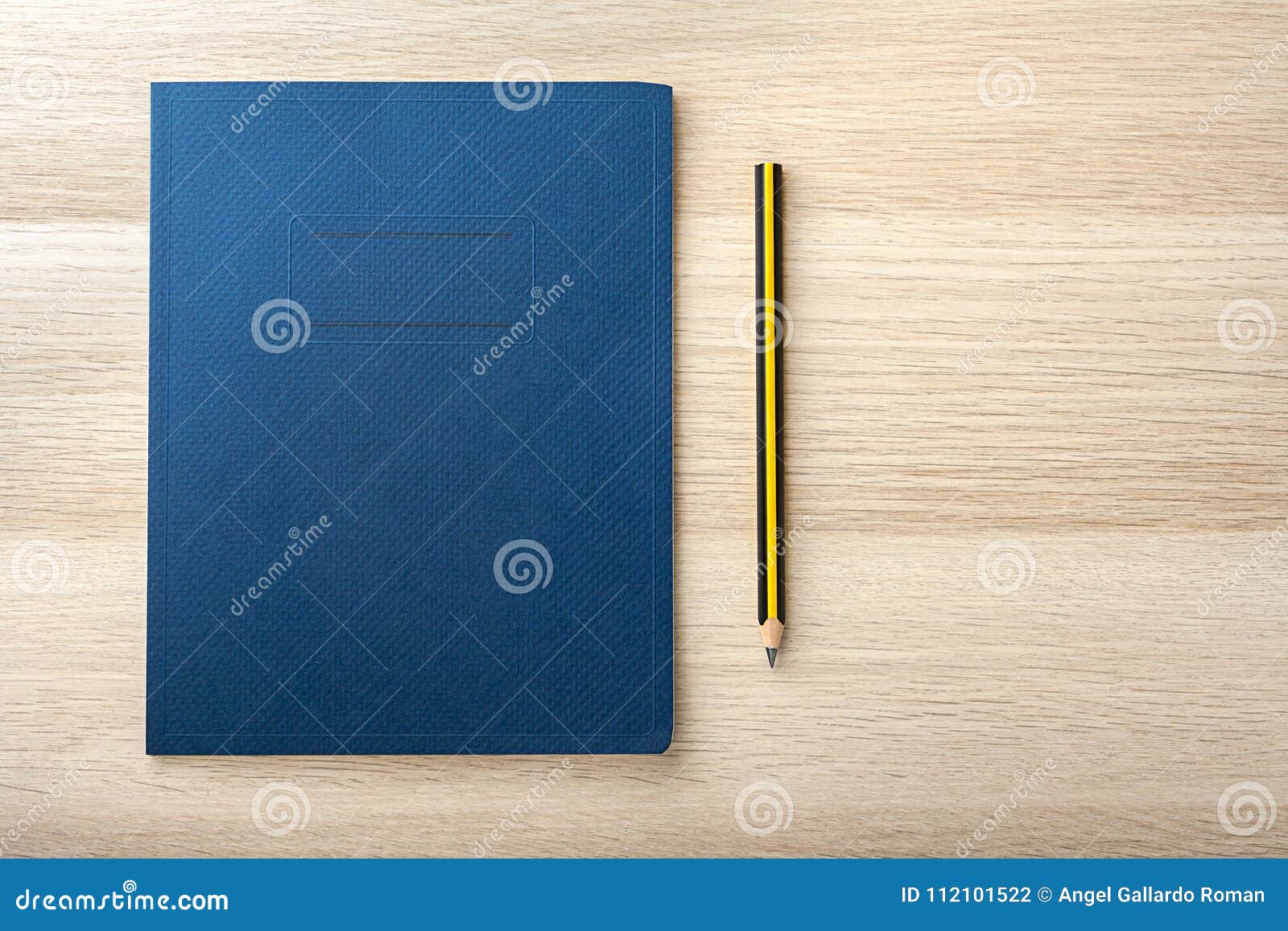 notepad on wooden desk with pencil