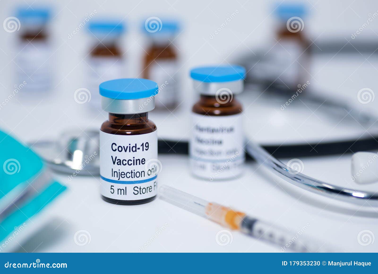 novel coronavirus covid-19 vaccine vial with syringe and stethoscope